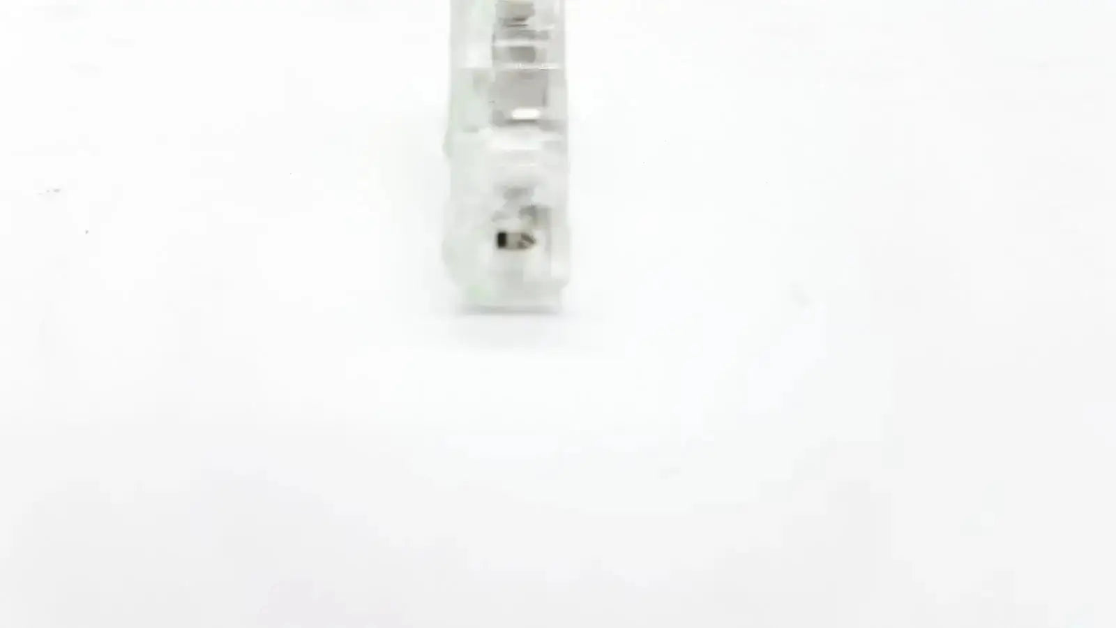 Clear plastic ecg adapter clip 2056813-014 rev a with visible internal metal contacts for secure electrical connection