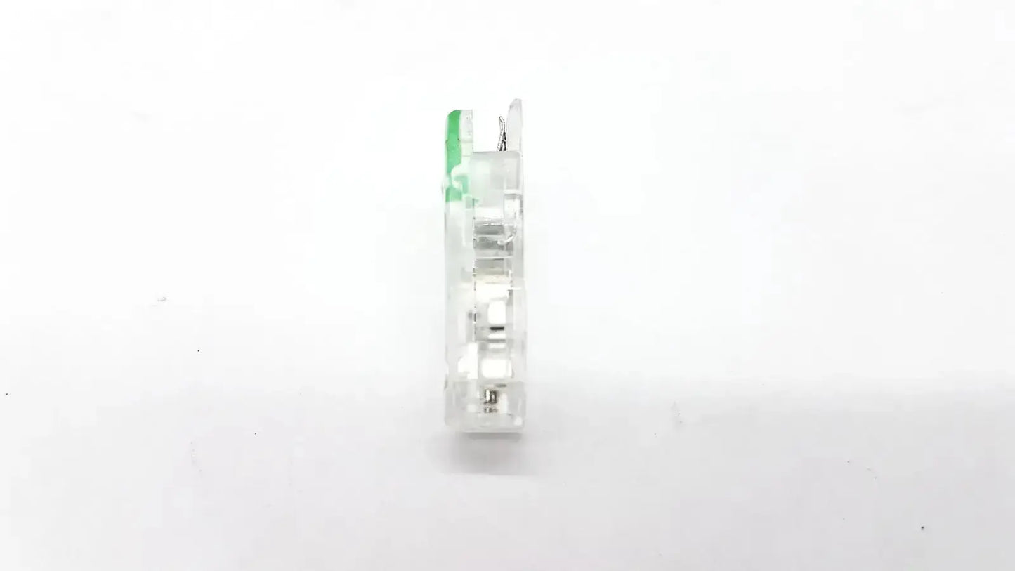 Clear plastic ECG adapter clip with green handle and metallic internal components for reliable electrical connection