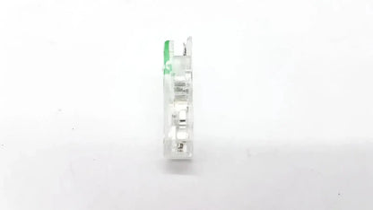 Clear plastic ECG adapter clip with green handle and metallic internal components for reliable electrical connection