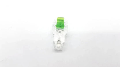 Clear plastic ecg adapter clip with bright green rectangular insert model 2056813-014 rev a for secure connections
