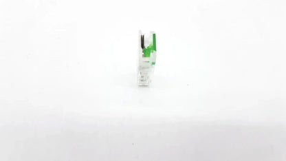White and green plastic ecg adapter clip with black internal components for medical electrocardiogram use