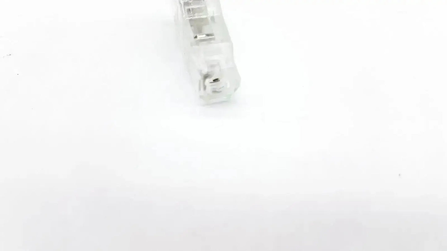 Clear plastic ecg adapter clip keycap with translucent frosted finish showing internal mechanical switch components