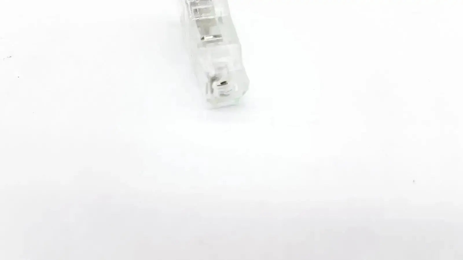 Clear plastic ecg adapter clip keycap with translucent frosted finish showing internal mechanical switch components