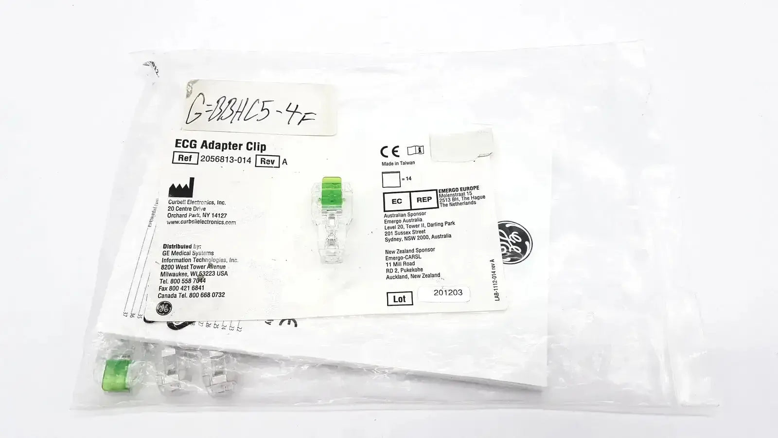 Green plastic ecg adapter clip 2056813-014 rev a sealed in medical packaging bag for medical device use