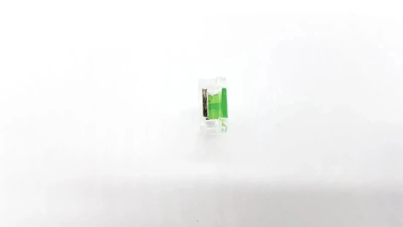 Ecg adapter clip 2056813-014 rev a with clear plastic connector and green internal component for secure adapter clip connection