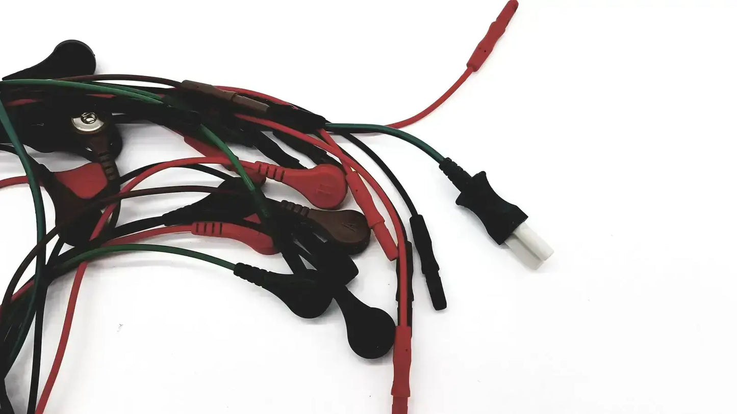 A bundle of ecg bedside monitor snap cables with red and green insulated wires and black plastic connectors for medical use