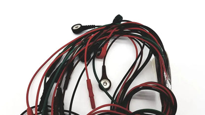 A bundle of red and black medical-grade ecg bedside monitor snap cables with metallic circular connectors
