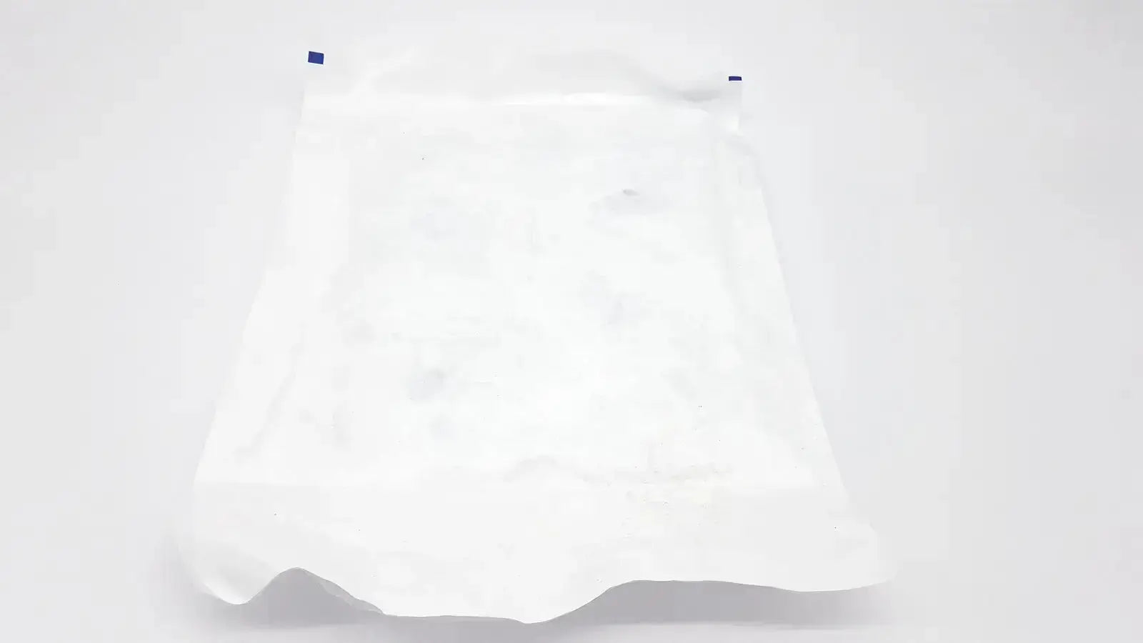 White plastic warmer drape exp bag with blue sealing tabs for ecolab ors-300 drape exp 2028 product packaging