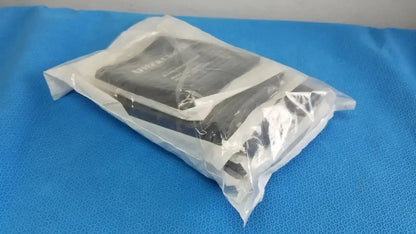 Black rectangular samsung device wrapped in clear plastic packaging used as an edan vital signs monitor