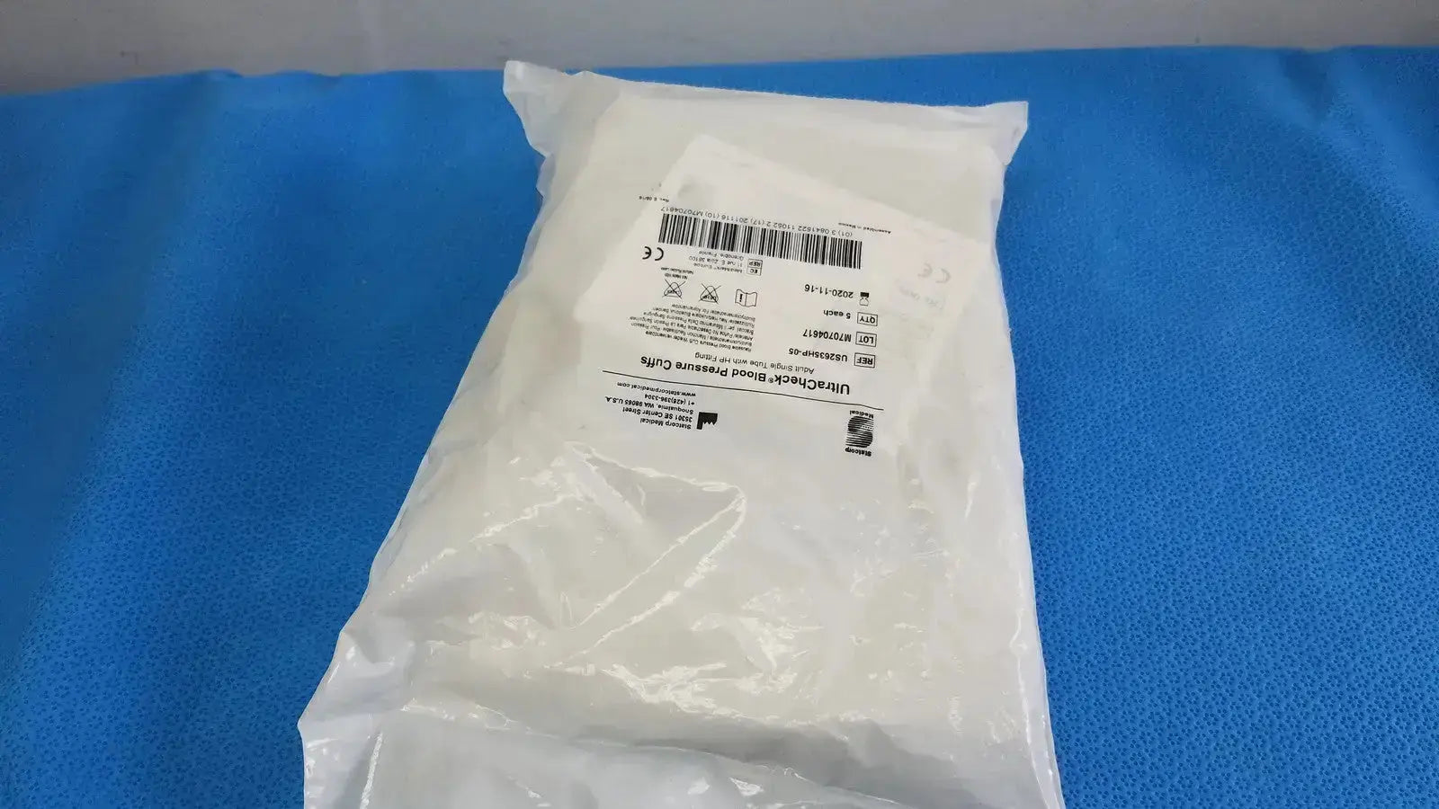 A white sterile surgical drape in clear packaging with printed labeling for edan vital signs monitor use