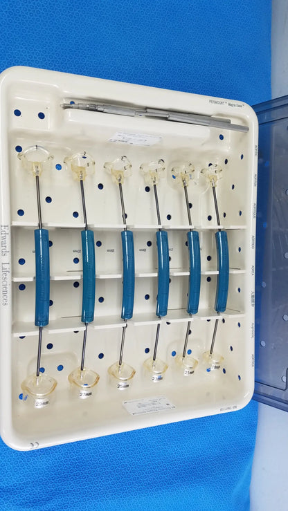 White plastic tray holding six blue-handled Edwards Life Science Perimount Magnas Ease aortic valve sizers for buy used medical equipment