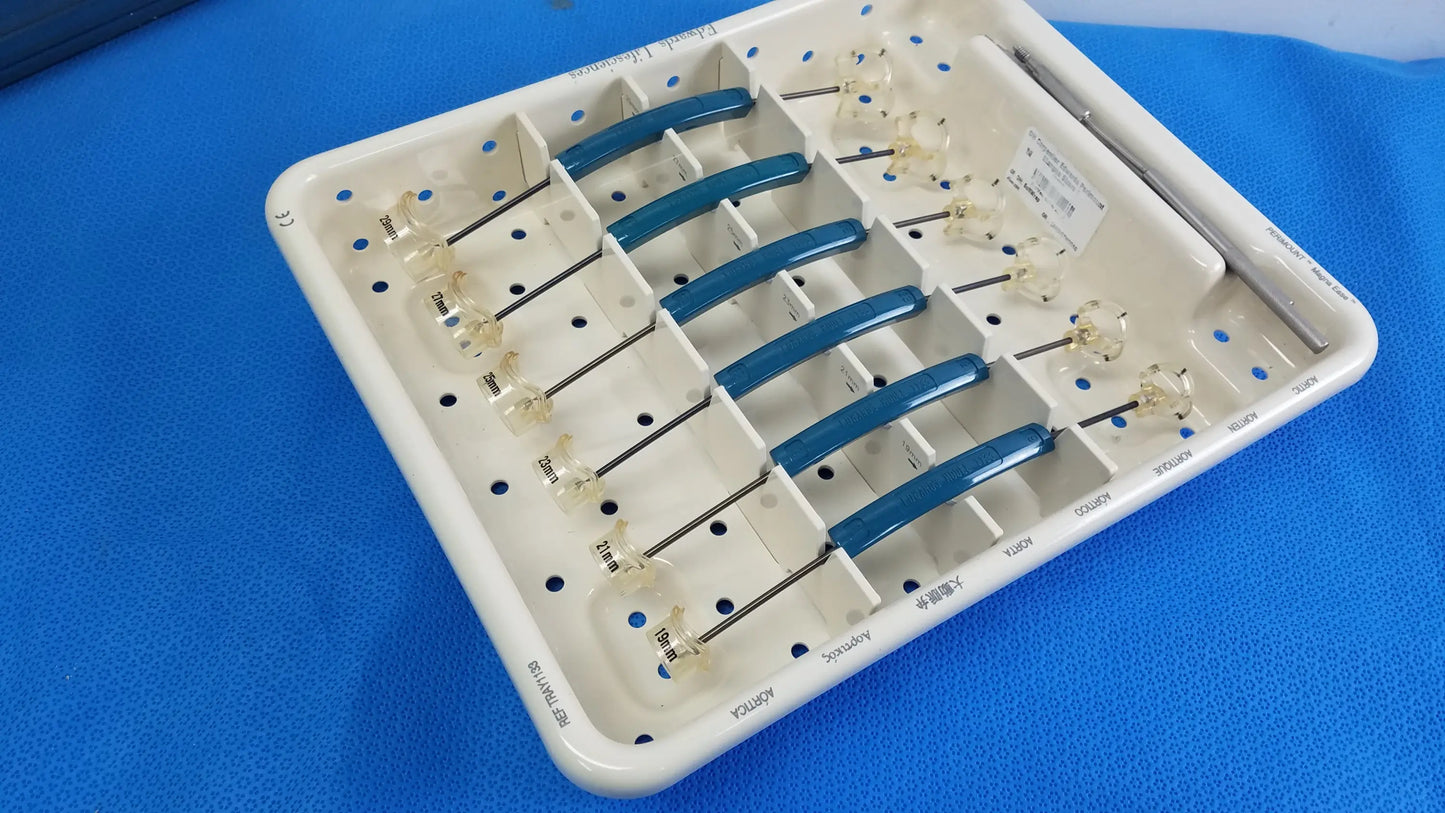 White plastic surgical tray holding six blue-handled dental instruments with glass tips for buy used medical equipment