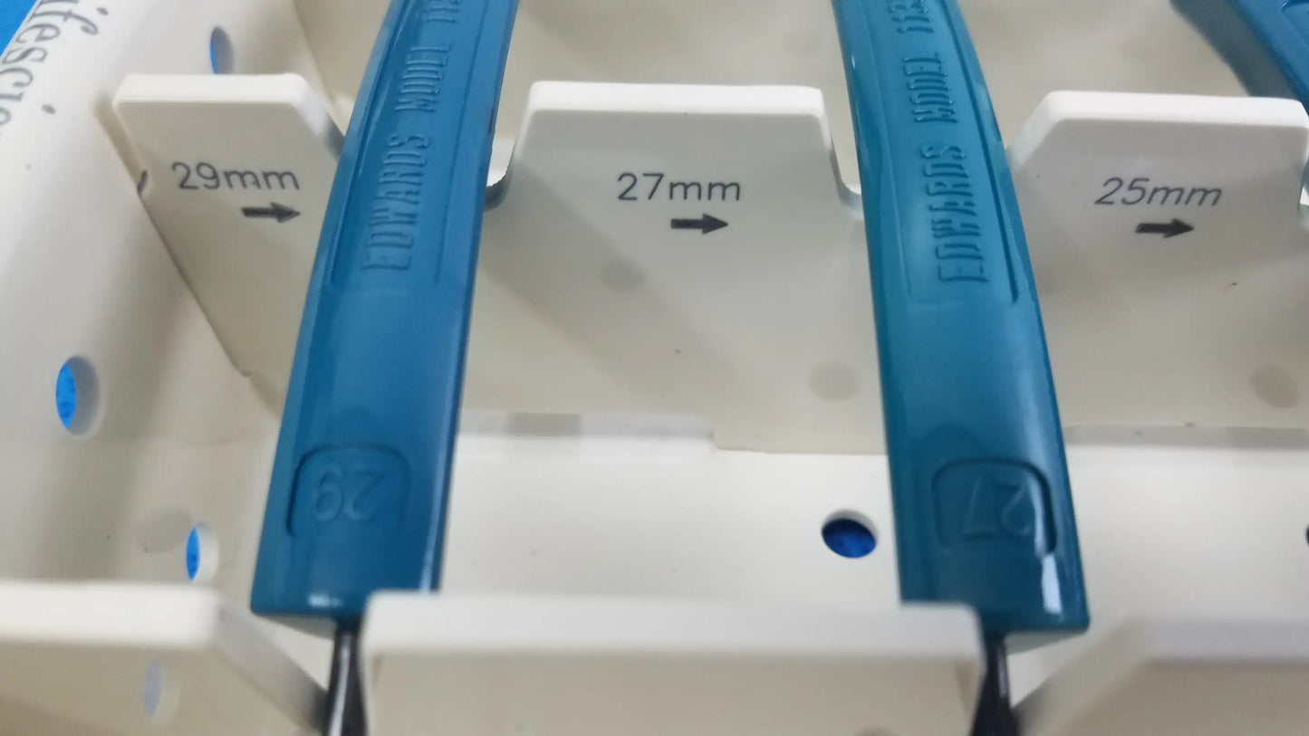 Blue plastic electrical circuit breakers with engraved size markings in edwards life science aortic valve sizer set for buy used medical equipment