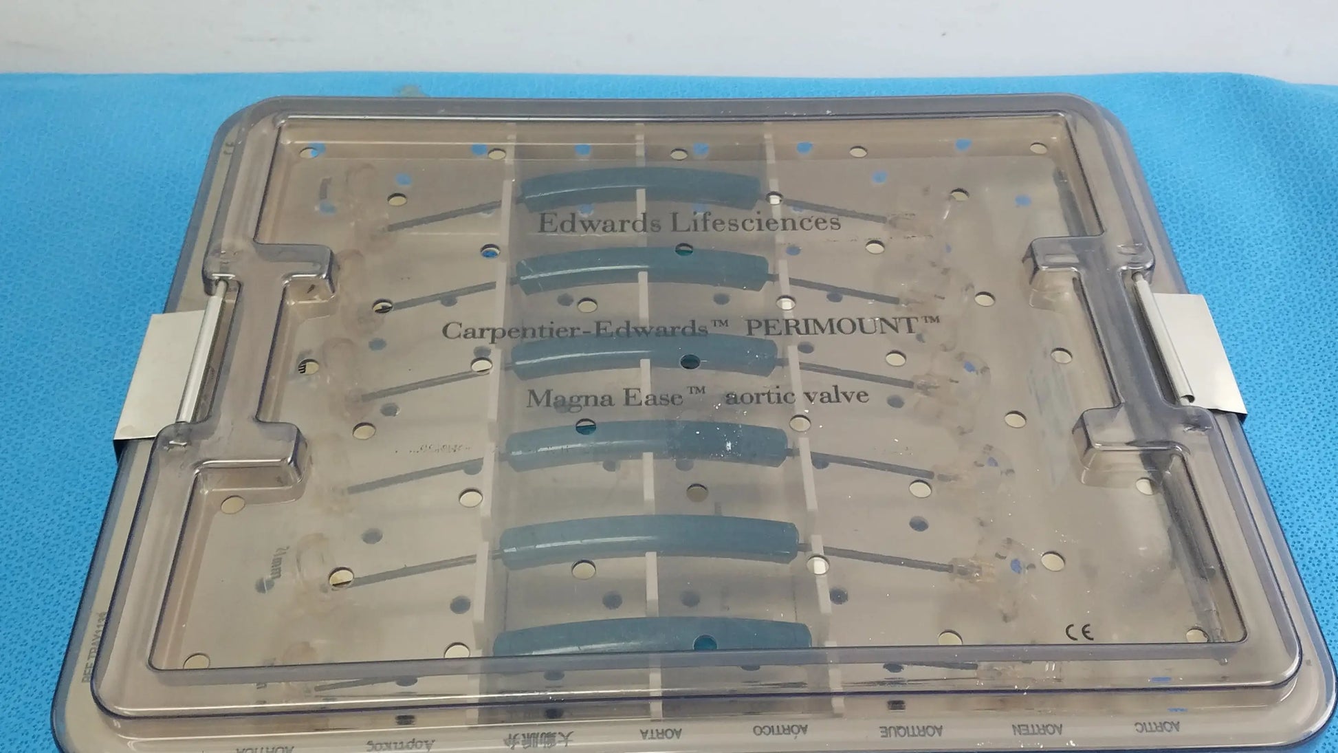 Clear plastic surgical tray with labeled compartments holding blue valve components from edwards life science 1111 aortic valve sizer set for buy used medical equipment