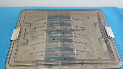 Clear plastic surgical tray with labeled compartments holding blue valve components from edwards life science 1111 aortic valve sizer set for buy used medical equipment
