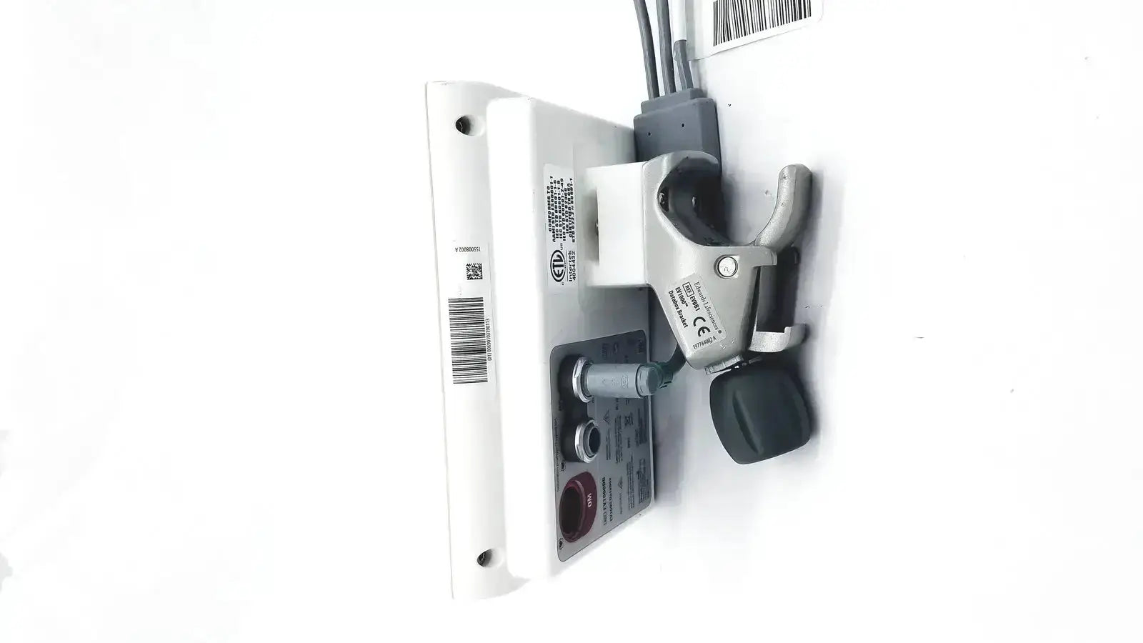 White plastic wall-mounted edwards lifesciences ev1000 databox with gray clamp and black handle for medical use