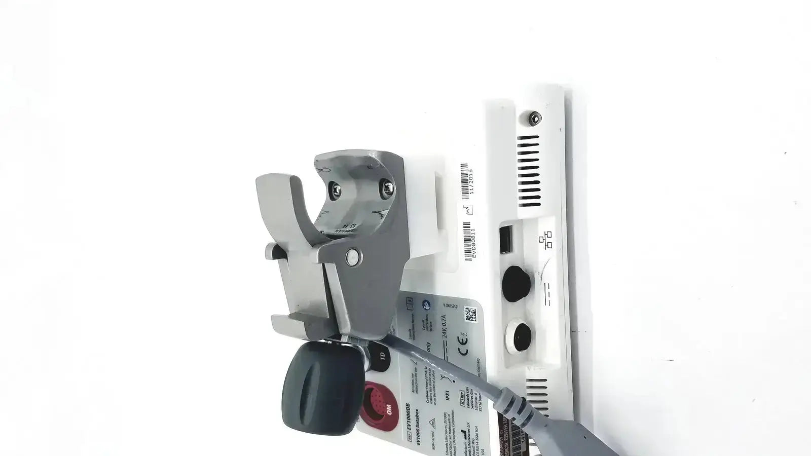 Gray and white edwards lifesciences ev1000 databox medical device with black handle showing ports and ventilation slots on back side