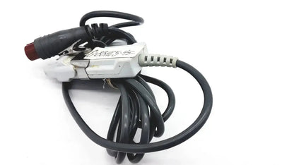Black coiled optical module cable adapter with white connector housing and red alligator clip for edwards lifesciences om2 oximetry