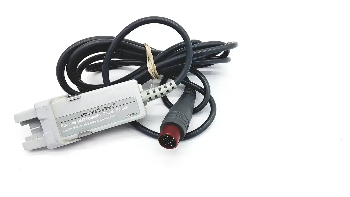 White plastic edwards lifesciences om2 oximetry optical module with black coiled cable and red connector end