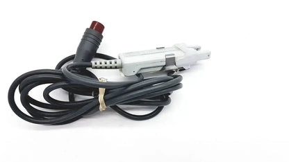 Black coiled edwards lifesciences om2 optical module cable with white plastic connector and red button end adapter