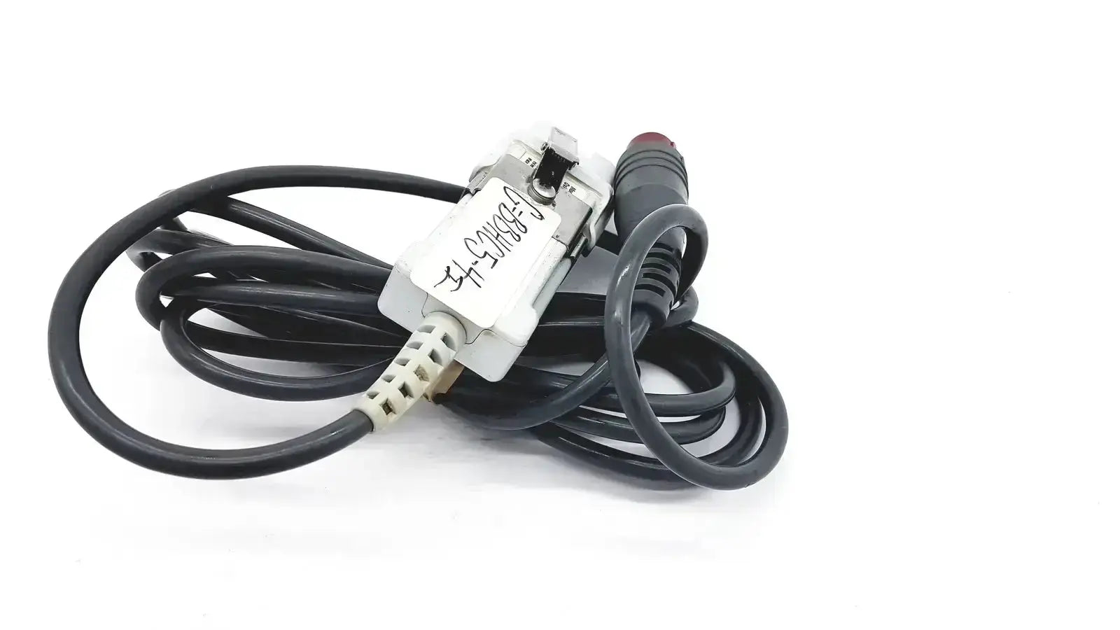 Black coiled edwards lifesciences om2 optical module cable with white rectangular connector and red-tipped plug adapter