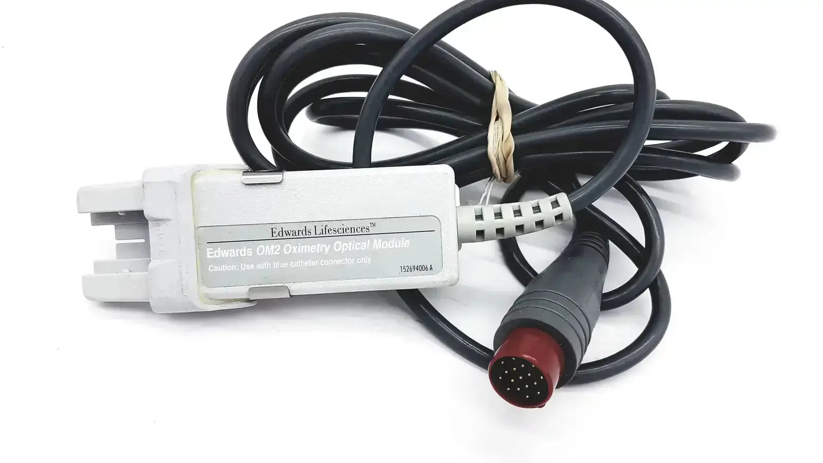 White plastic edwards lifesciences om2 oximetry optical module cable adapter with black coiled cable and red connector