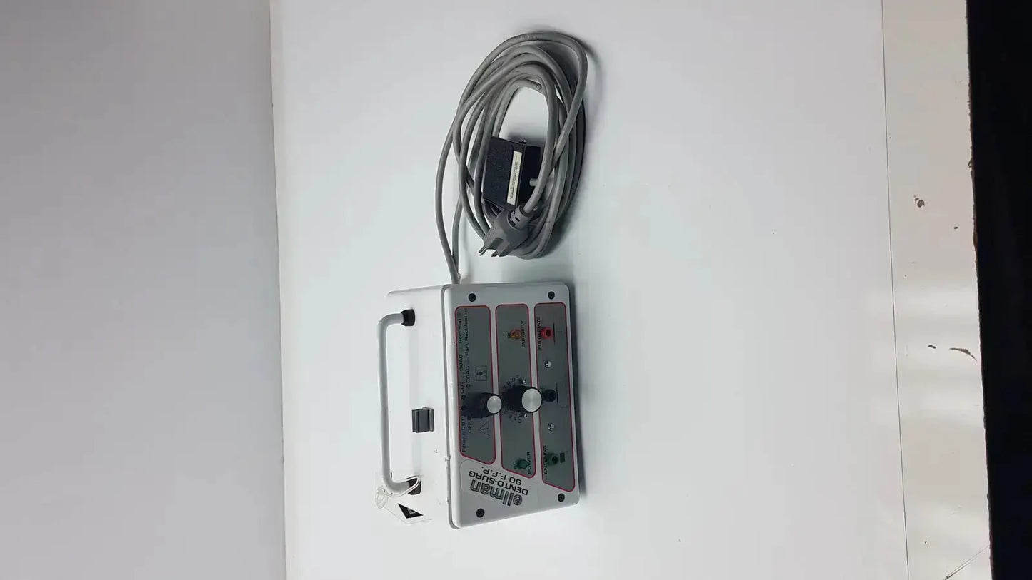 Silver aluminum industrial control panel with coiled gray cable and labeled switches for patient ready ellman dento surg