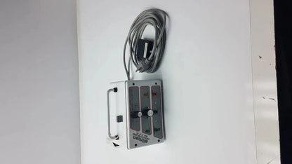 Silver aluminum industrial control panel with coiled gray cable and labeled switches for patient ready ellman dento surg