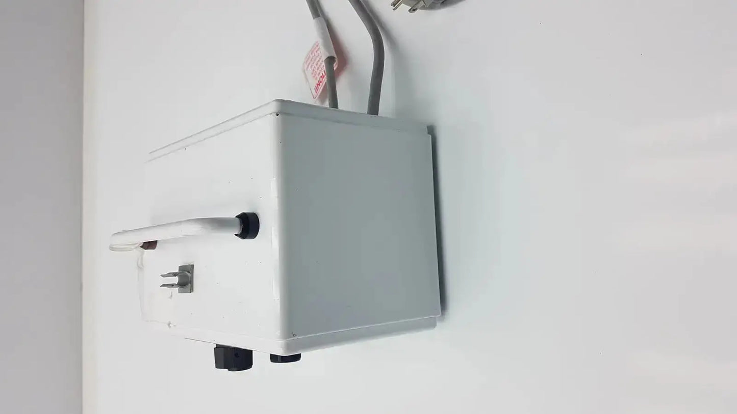 White rectangular electrical outlet box with black plastic knobs and white handle on the side for ellman dento surg patient ready use