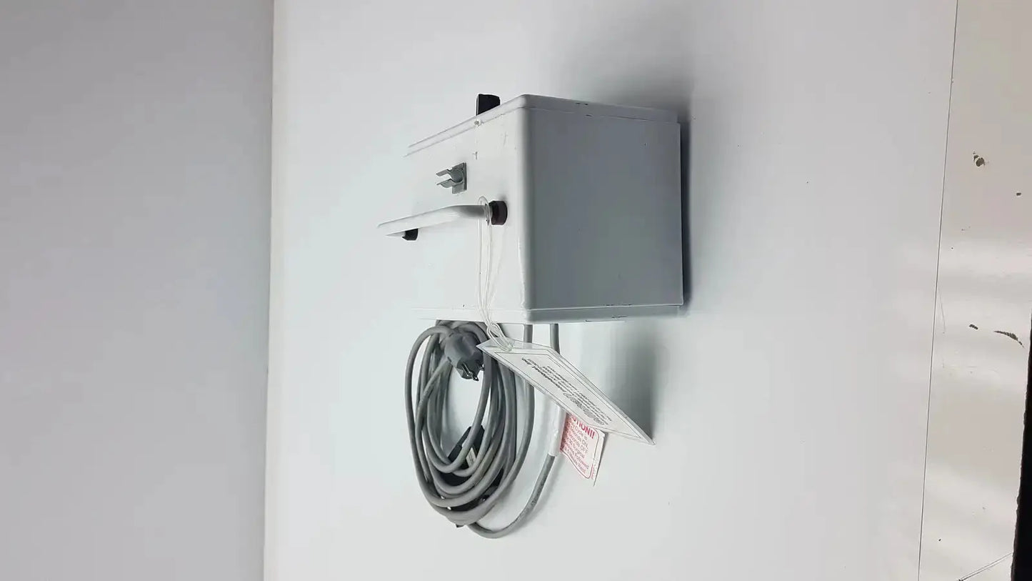 Gray rectangular electrical outlet box with coiled power cord attached showing back side of patient ready ellman dento surg device