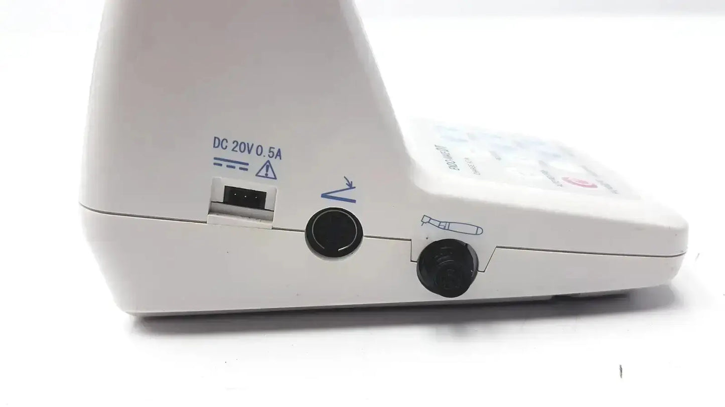 Back side of white endo mate dt endodontic micromotor showing dc 20v 0.5a power port and two black circular ports on pre owned medical equipment