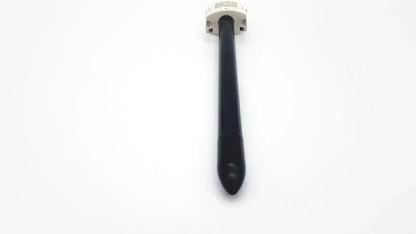 Black endowrist stapler cannula with white connector featuring a blunt obturator for precise surgical use