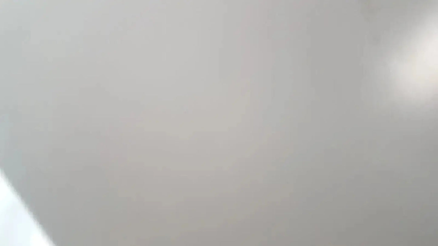 Smooth off-white ceiling of Enthermics blanket warming cabinet DC250 with soft gradient and subtle light reflection