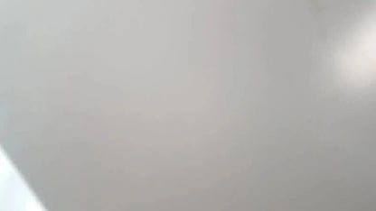 Smooth off-white ceiling of Enthermics blanket warming cabinet DC250 with soft gradient and subtle light reflection