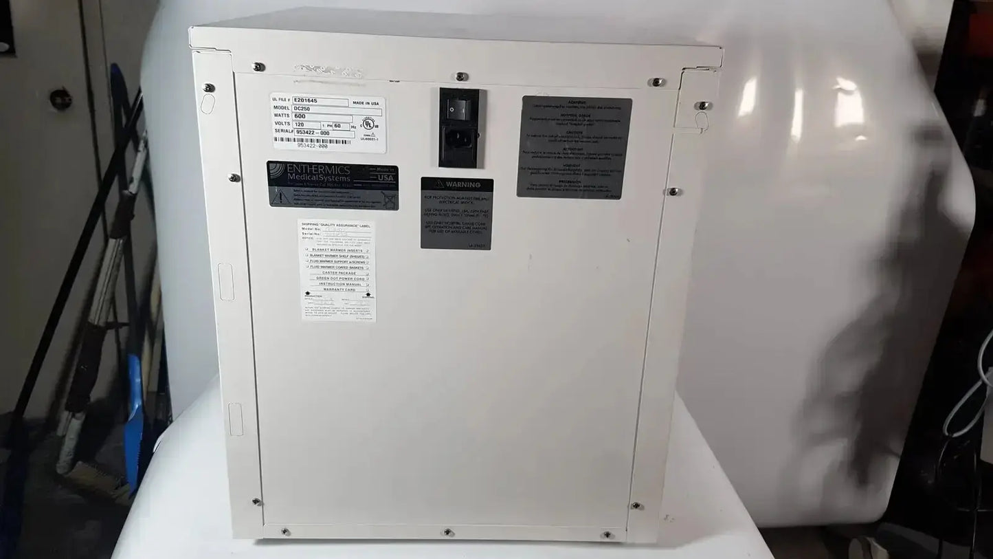 White industrial-grade electrical panel with black labels and power switch on enthermics blanket warming cabinet dc250