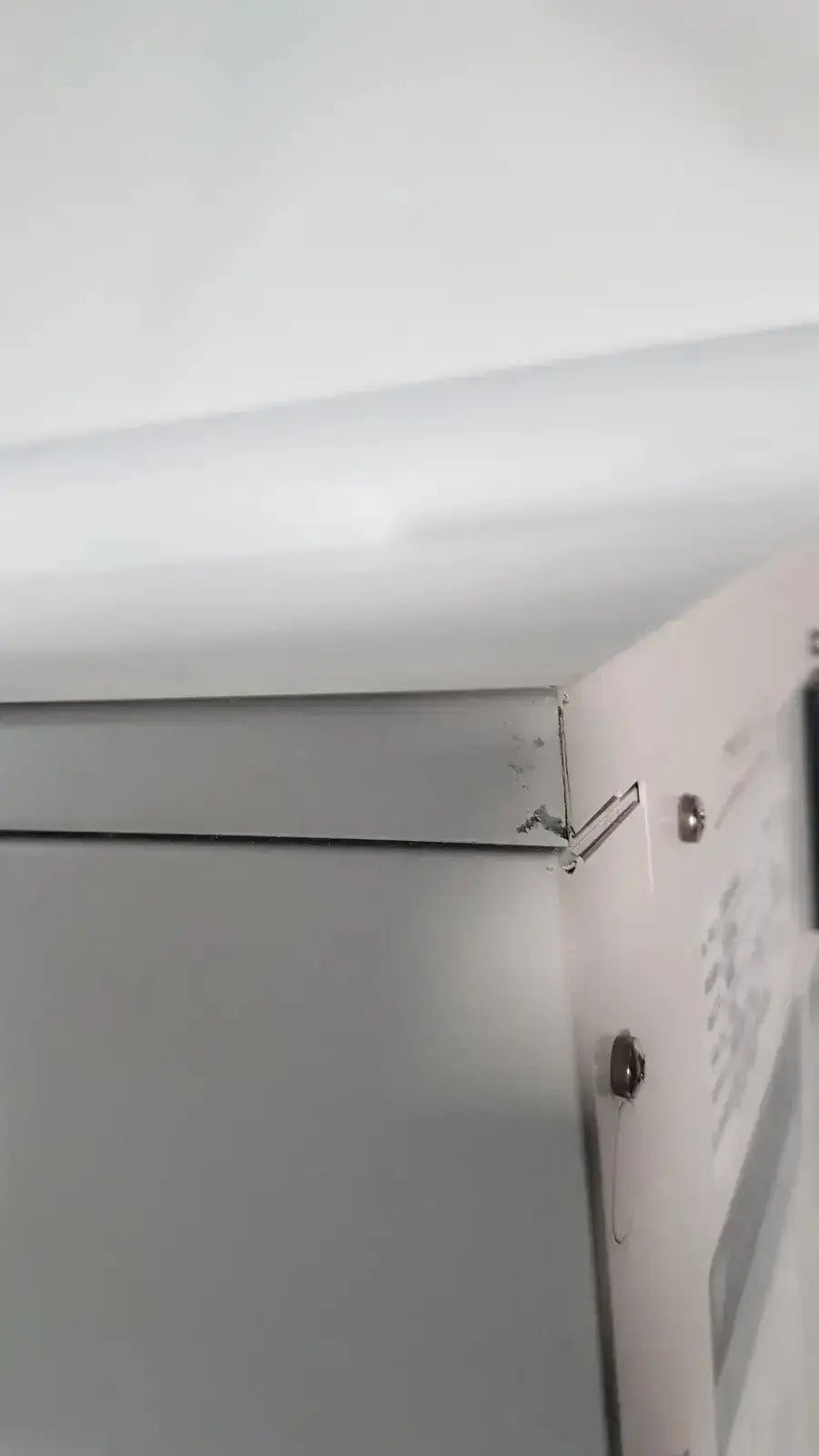 A sleek metallic silver corner bracket for the enthermics blanket warming cabinet dc250 with minimalist design