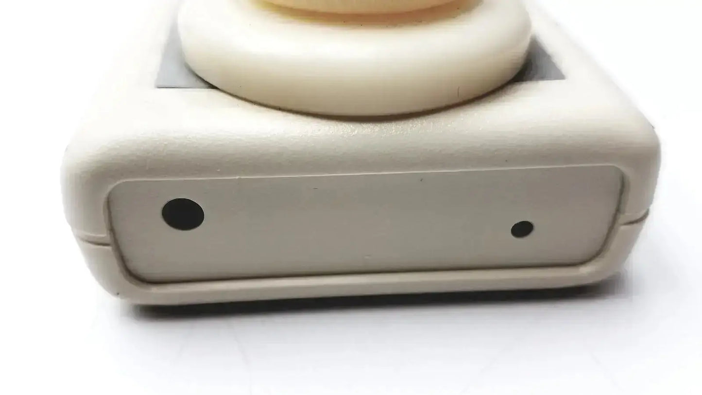 Cream-colored plastic environmental sensors z100 ethylene oxide meter with rounded top and black circular indentations