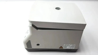 White laboratory centrifuge with gray base and ventilation slits for buy used medical equipment pre owned medical equipment