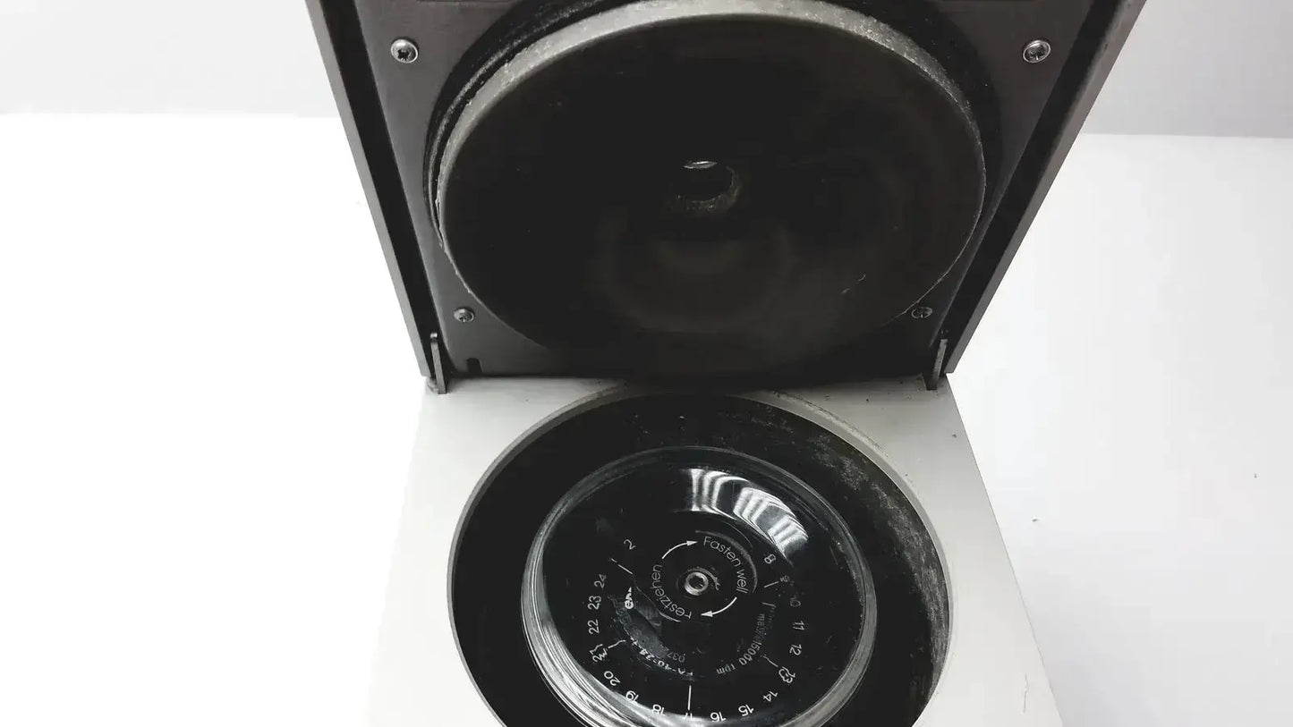 Black eppendorf 5424 centrifuge with circular rotor chamber and numerical lid markings available as pre owned medical equipment
