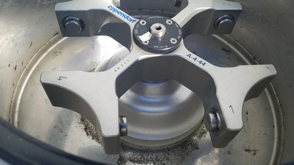 Silver metallic centrifuge rotor with engraved markings and eppendorf hub in eppendorf 5804 refrigerated benchtop centrifuge for buy used medical equipment