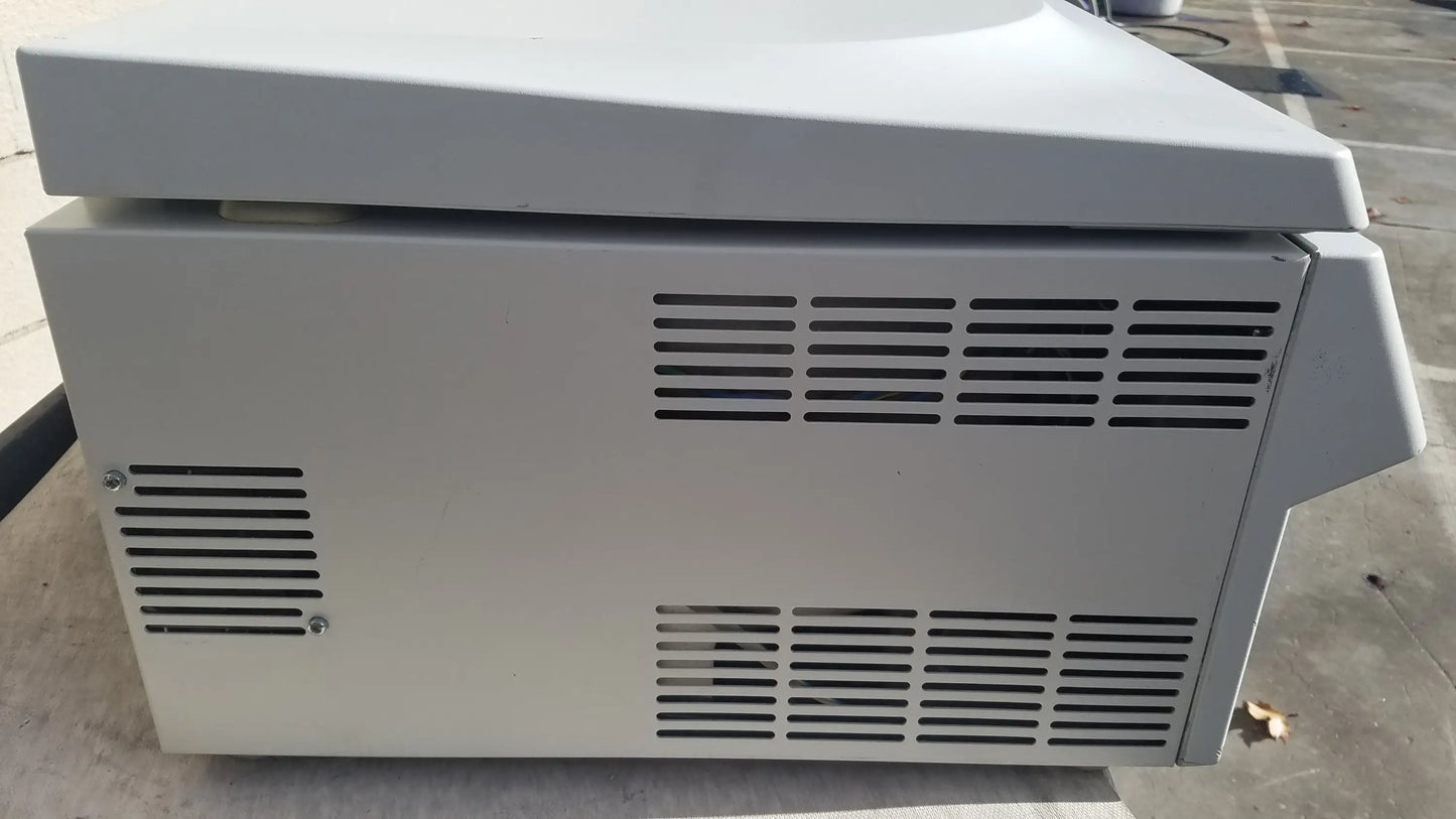 White plastic eppendorf 5804 refrigerated benchtop centrifuge with rectangular body and ventilation slits for pre owned medical equipment sale