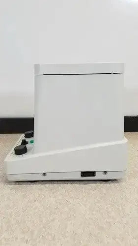 White rectangular eppendorf centrifuge 5415c with black knobs and green indicator light on the front panel
