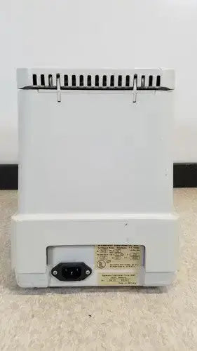 Rear view of white plastic desktop computer tower with vented top and power input port on eppendorf centrifuge 5415c