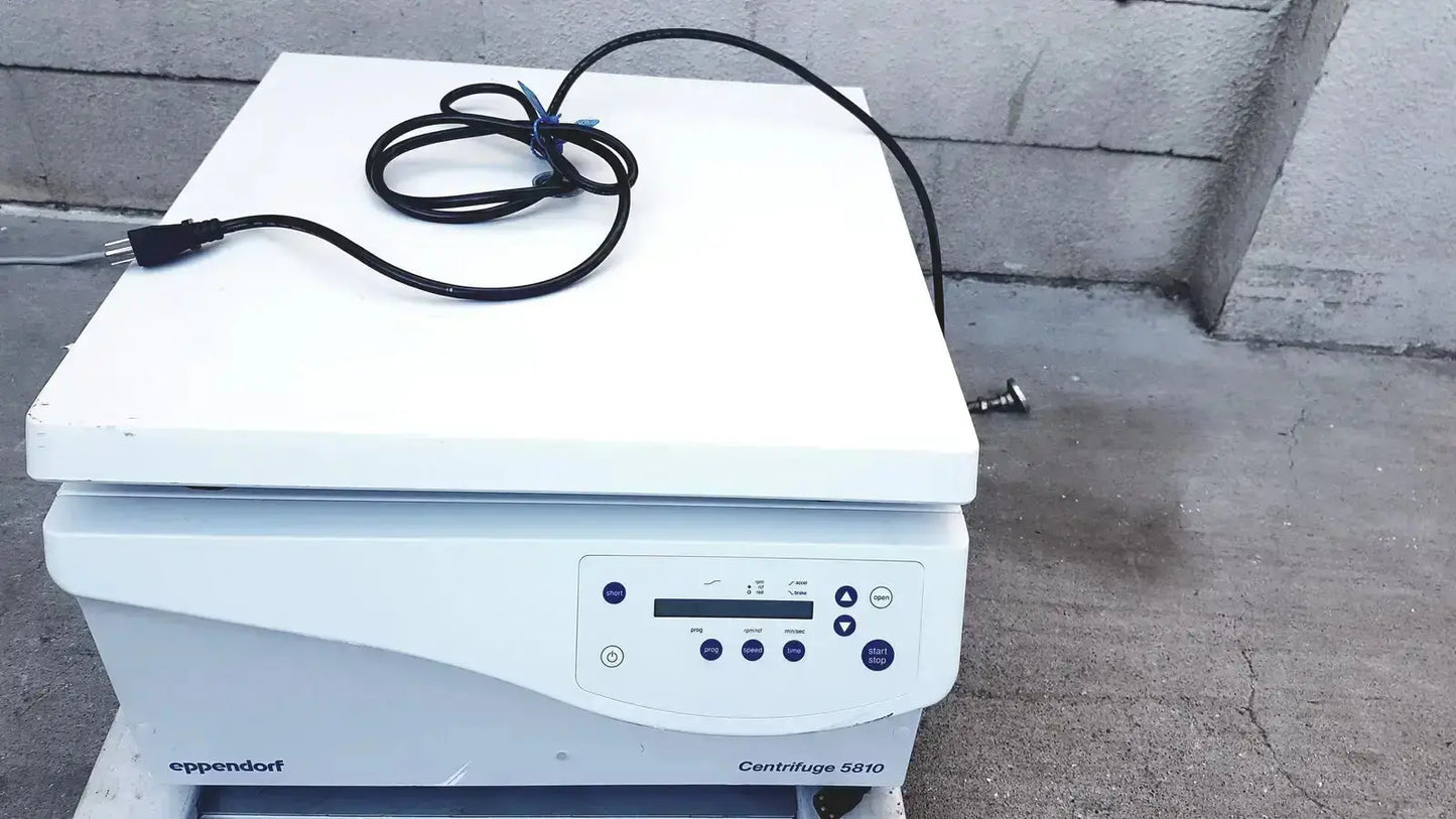 White eppendorf centrifuge 5810 with coiled black power cord on top ideal for hospital surplus biomedical technicians