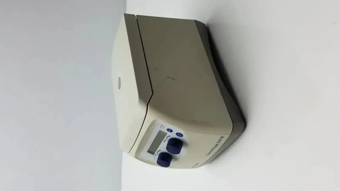 Beige eppendorf model 5418 microcentrifuge with digital display and blue control knobs for laboratory use