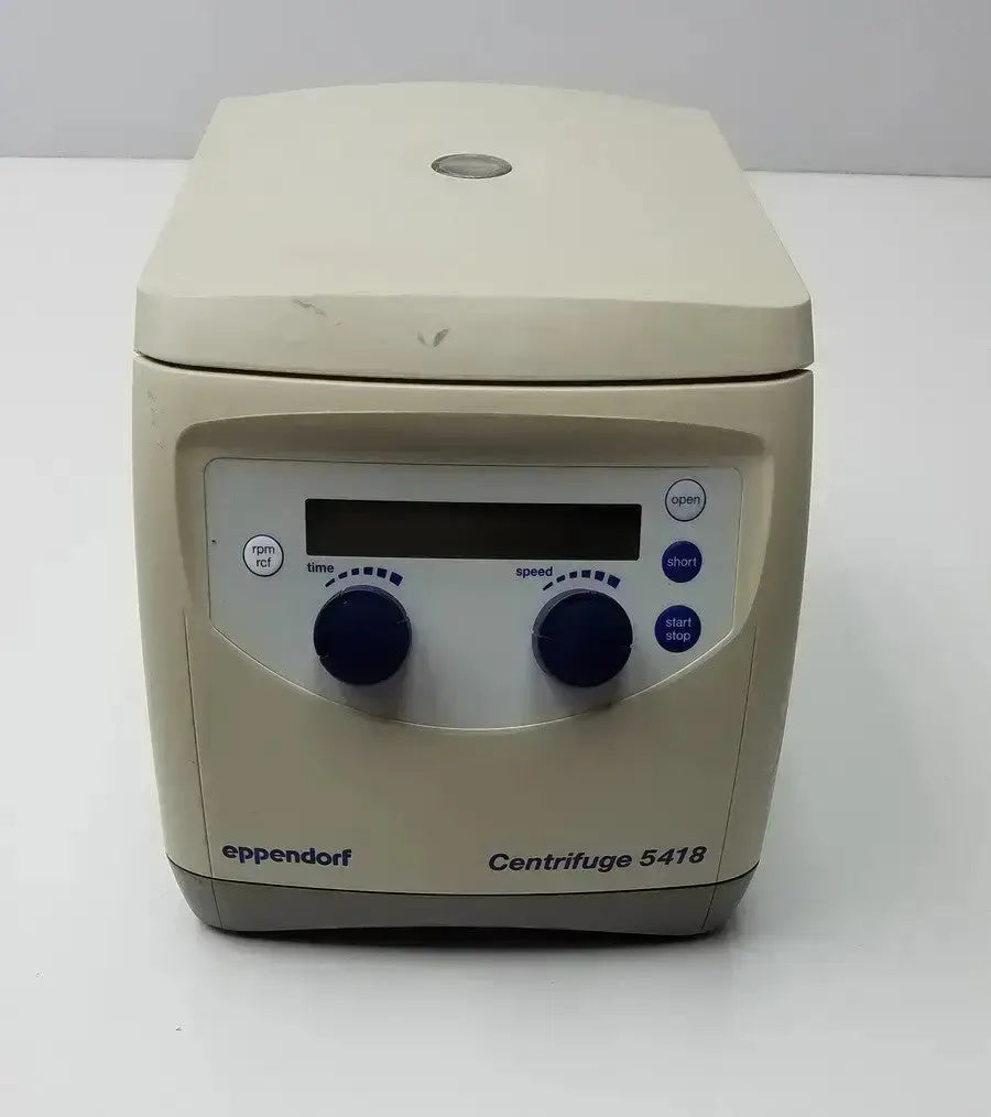 Beige eppendorf model 5418 microcentrifuge with black control knobs and blue buttons for laboratory use in medical settings