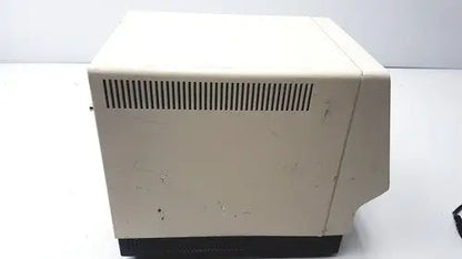Beige plastic esa 5200a detector with black base and vertical ventilation slits on the back side of the device