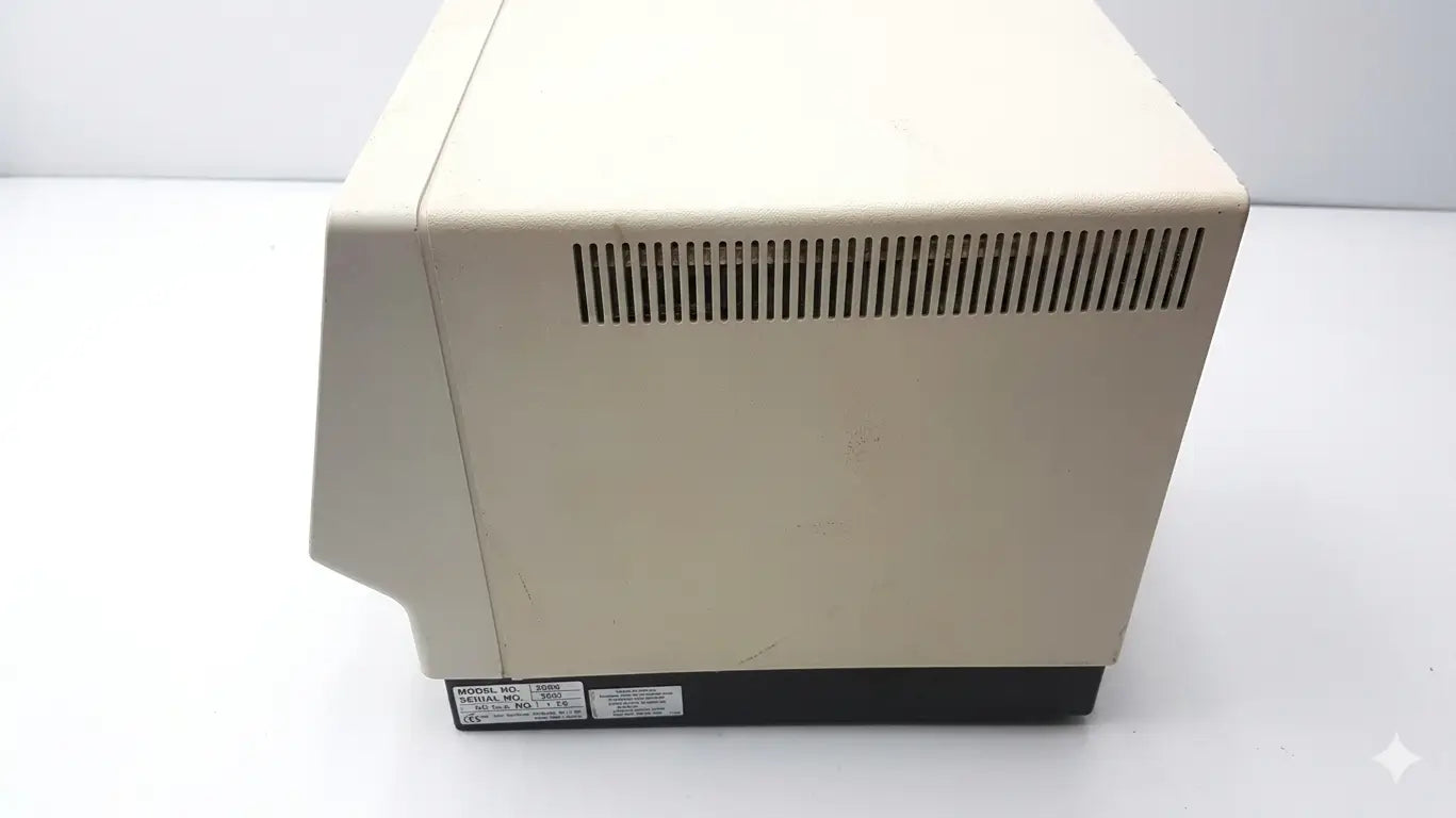 Beige plastic desktop microwave with black base and vertical slotted vent side for esa coulochem ii lab electrochemical detector 5200a