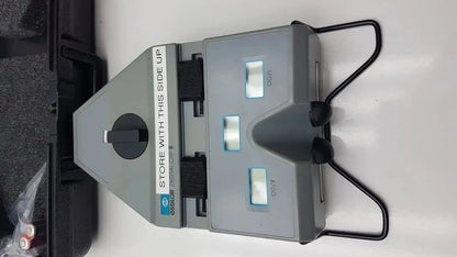 Gray plastic Essilor X81701 precision digital crp corneal reflection pupilometer with black handles and three illuminated displays