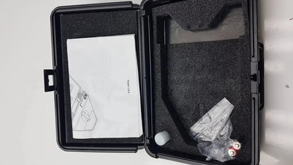 Black hard-shell case with molded foam interior holding essilor x81701 precision digital crp pupilometer components and manual